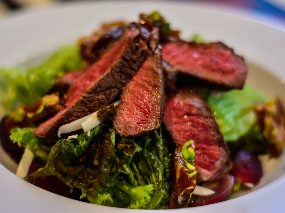 Beef tagliata at STR·EAT, rare beef sliced over leaves with shaved parmesan